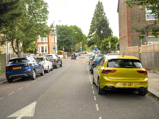 Yellow car parked on street
