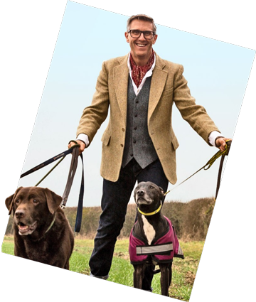 Graeme Hall walking two dogs